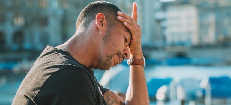 A man having a headache before marijuana rehab