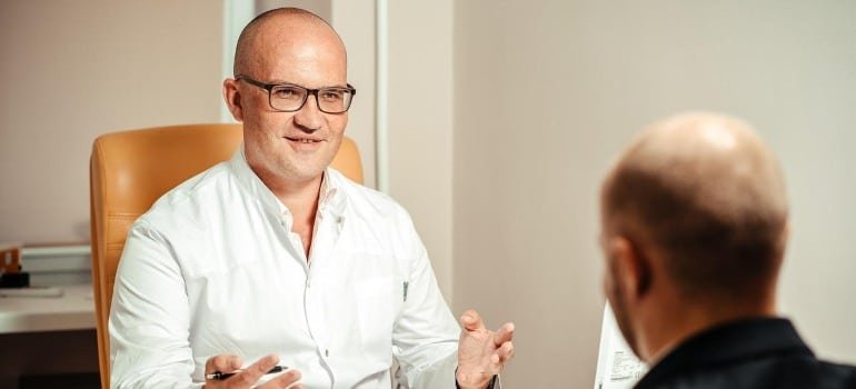 A doctor talking to a patient.