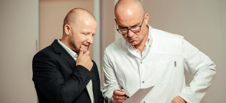 A doctor and a patient discussing treatment.