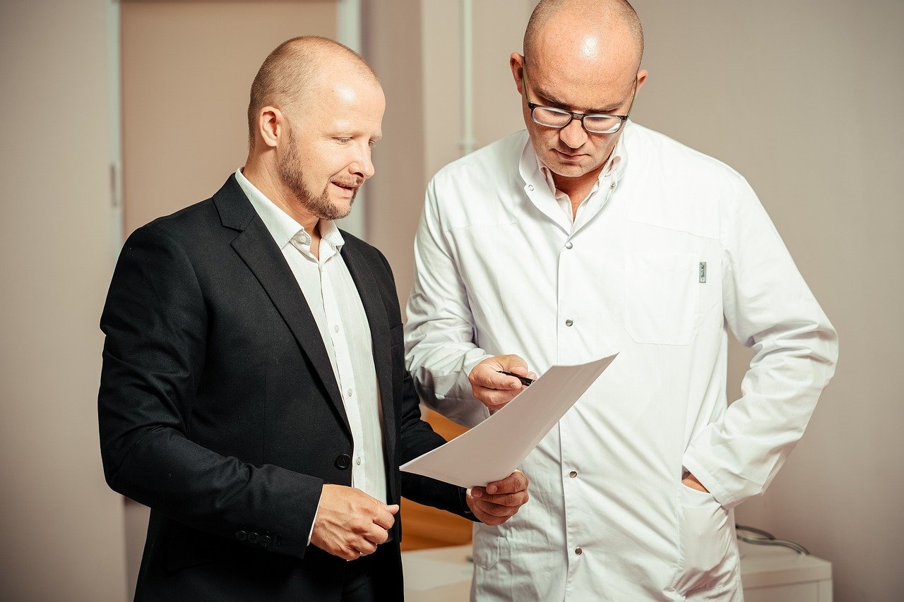 A doctor talking to a patient.