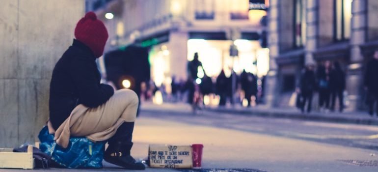 homeless person on the street, representing homelessness and substance abuse