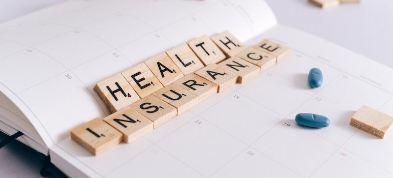 Scrabble letters spelling health insurance