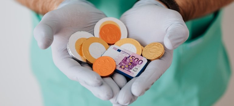 person holding money, representing Cigna rehab coverage