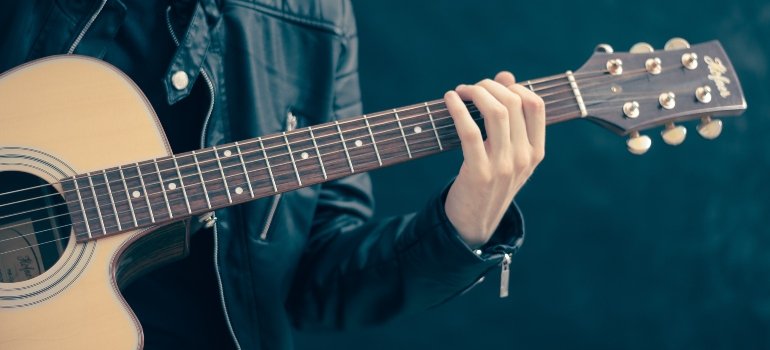 person playing a guitar