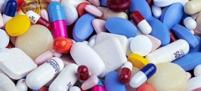 Pills and tablets in a pile.