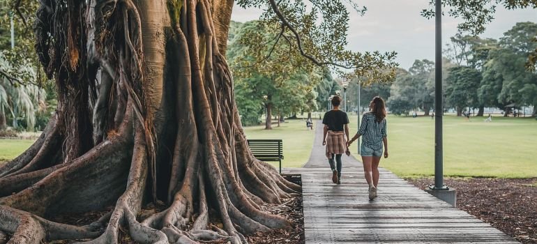 A man and a woman walking and talking about the life skills you learn after PA alcohol recovery.