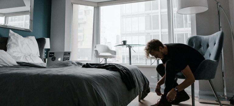 a man tying his shoes