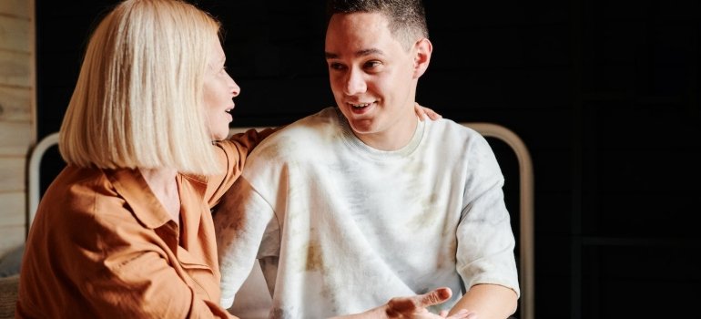 a mom talking to her son, representing preparing for a loved one's return from PA rehab