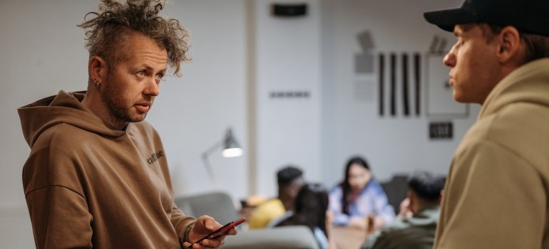 a man talking to a friend trying to understand winter blues and its impact on those in PA recovery