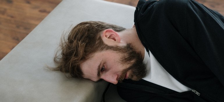 man thinking about how mental health stigma among men affects substance abuse
