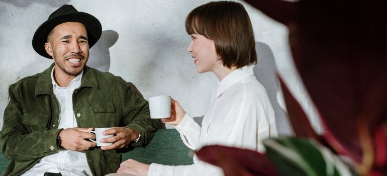 a man and a woman on a date drinking coffee