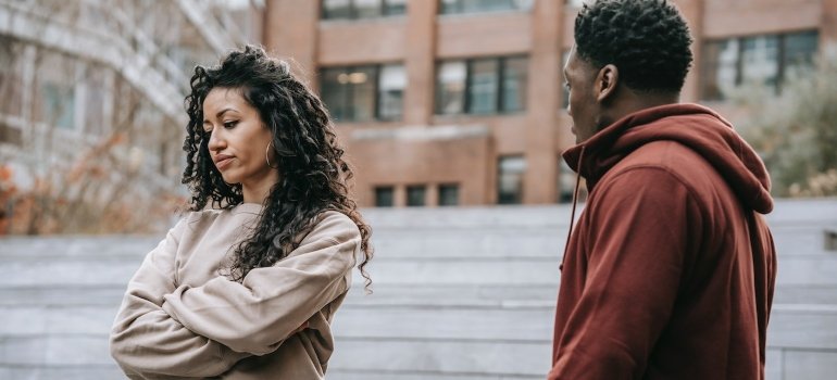 a couple arguing on the street