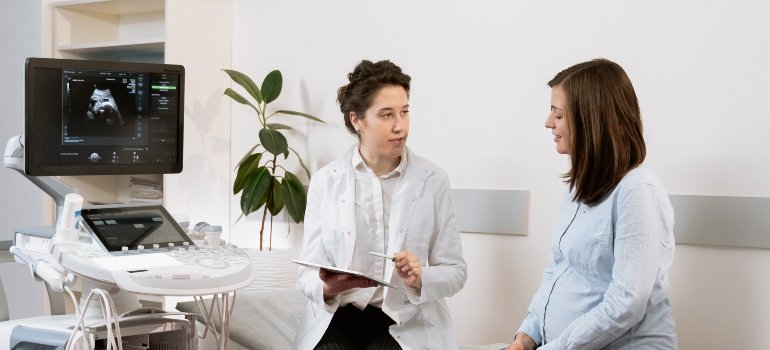 doctor performing an assessment for self-harm and addiction