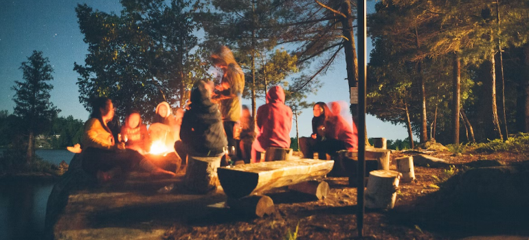 A group of friends having a picnic in a forest.
