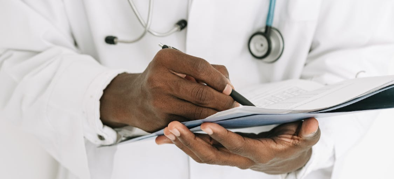 A doctor keeping notes.