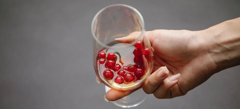 person holding a glass of alcohol