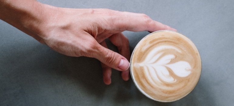 person holding a coffee mug