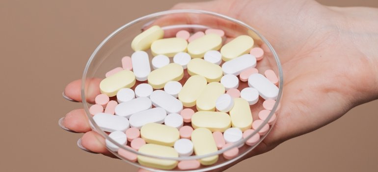 person holding a bowl of drugs