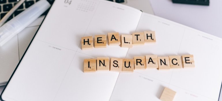 blocks spelling "health insuance"