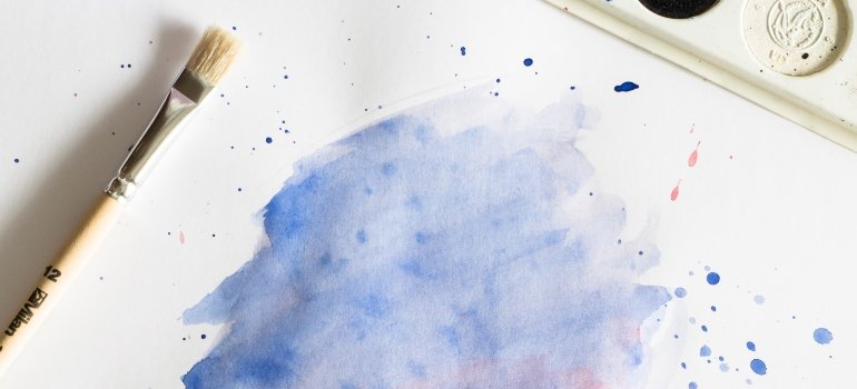 paintbrush and a small painting