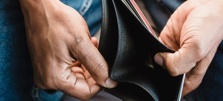 person holding an empty wallet