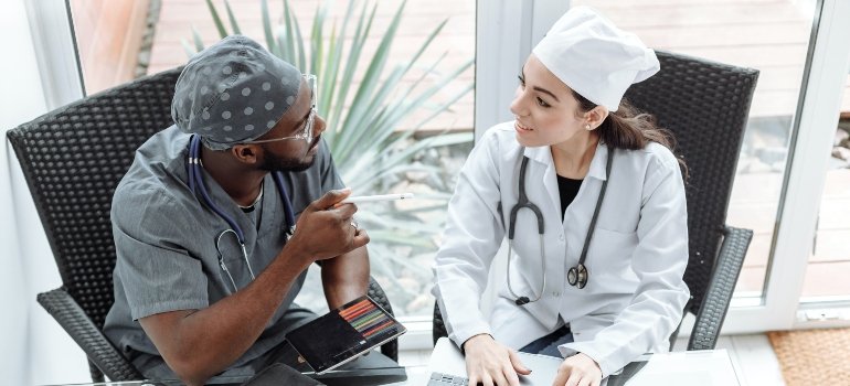 two doctors talking about How Long Does Heroin Detox Take