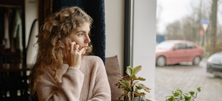 person talking about the link between domestic violence & addiction in Pennsylvania over the phone