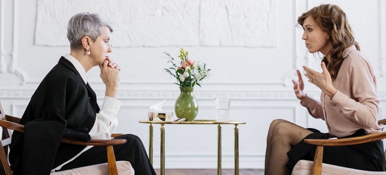 two people talking about prescription medications in medication-assisted treatment