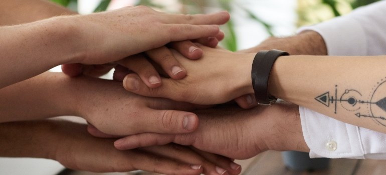 several hands joined together