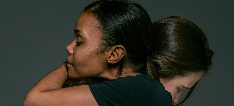 person hugging another person