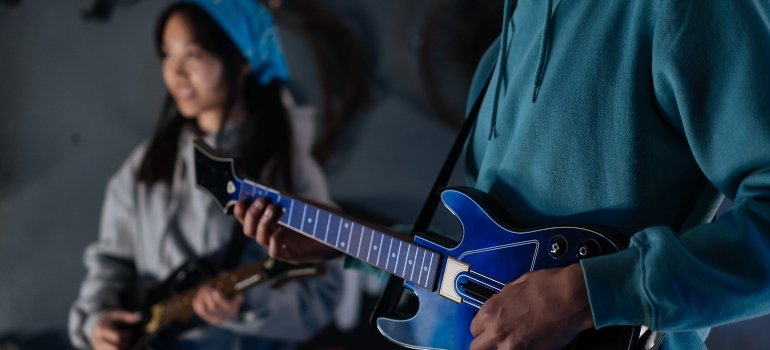 two people playing a music game