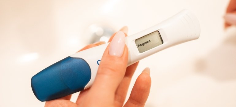 person holding a pregnancy test
