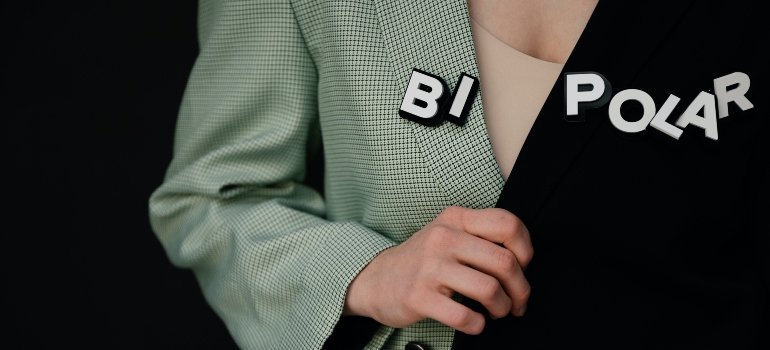 person wearing a shirt that says "bi polar"