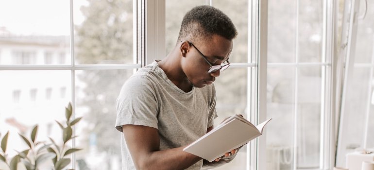 person reading about the demographic factors and facilitators to heroin addiction