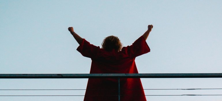 person celebrating a milestone while traveling across Pennsylvania sober