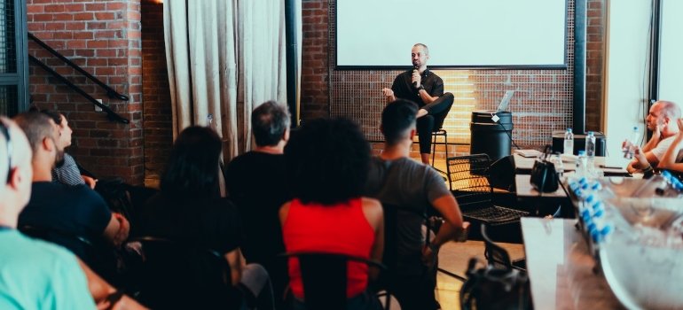 Group of people during a seminar on alcoholism and depression