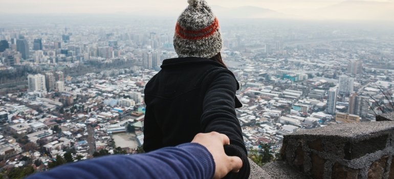 person looking at a city's skyline