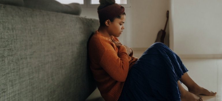 Woman experiencing consequences of risk factors of a Dual Diagnosis Disorder.