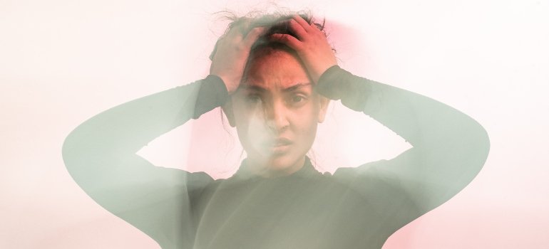 Woman thinking about risk factors of a Dual Diagnosis Disorder.