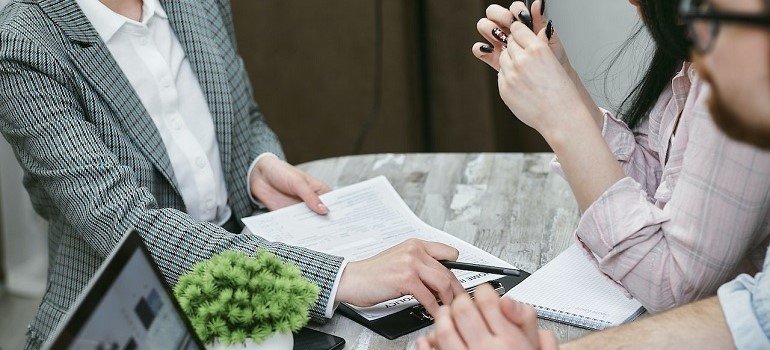 People reviewing insurance options for dual diagnosis treatment after being rejected.