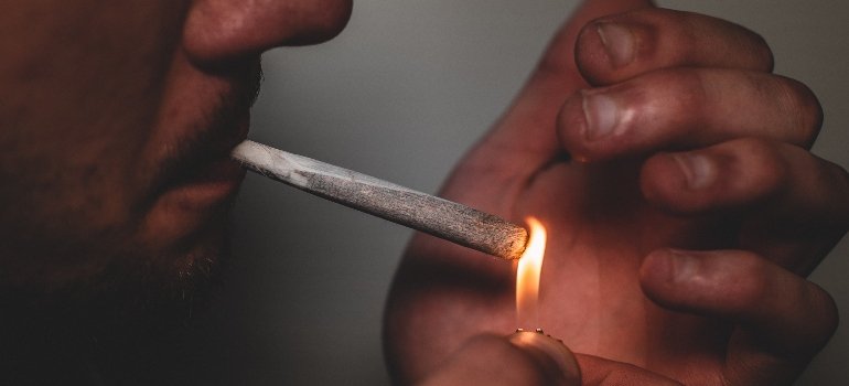 man smoking some form of drug