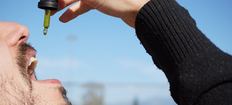 Man using cannabis oil for medical purposes.