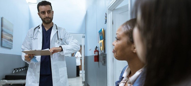 Patients consulting with doctor.