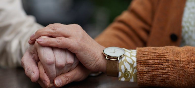 People holding hands in support after rehab in PA