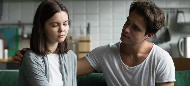 male spouse comforting his significant other