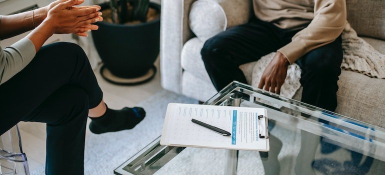 Guy talking to the therapist about heroin addiction.