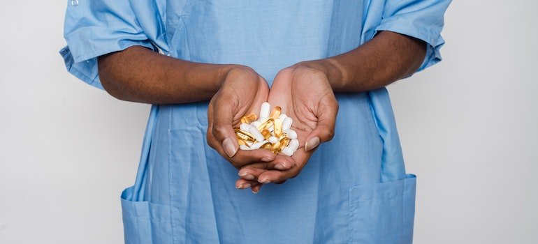 Scientist holding medicine.