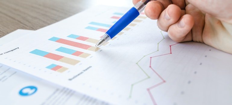 a pen pointing to a graph