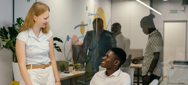a woman and a man in an office talking about the Addiction in the Pennsylvania Workforce