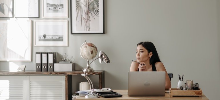a woman sitting in her office and thinking about the Addiction in the Pennsylvania Workforce